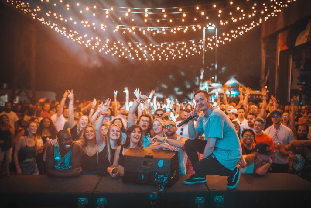 Proppa taking a photo with the crowd at one of his shows in 2023.