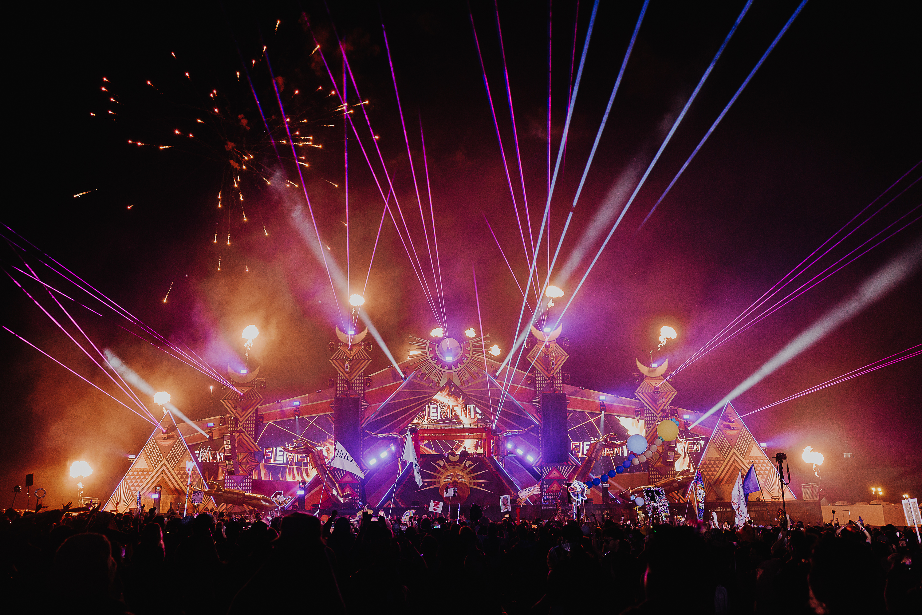 Fireworks and lasers shooting from the background of the Fire Stage