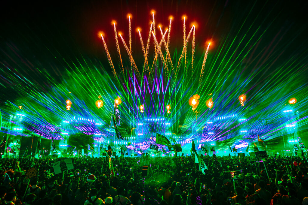 Wide shot of Escape mainstage with fireworks, lasers, and pyrotechnics.