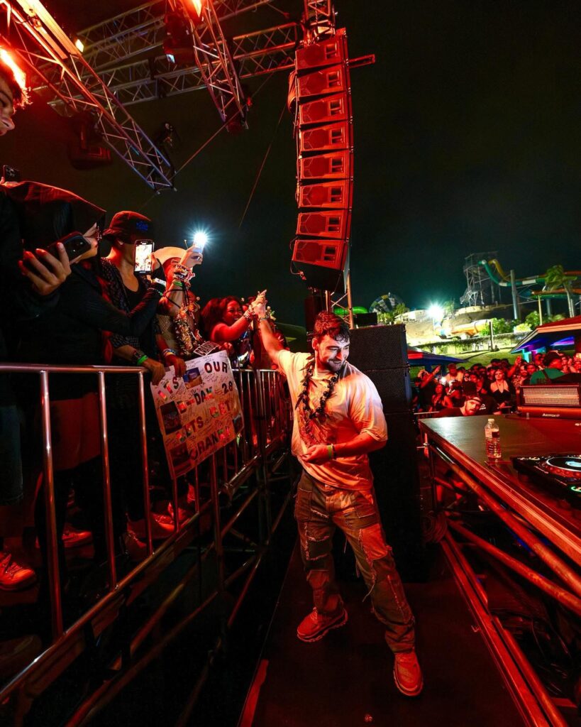 Crankdat high fiving a fan on the rail