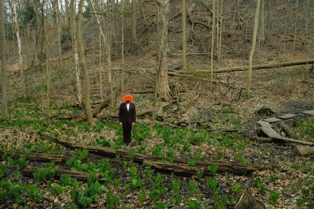 Ricky Bamboo with mushroom hat in forest photo