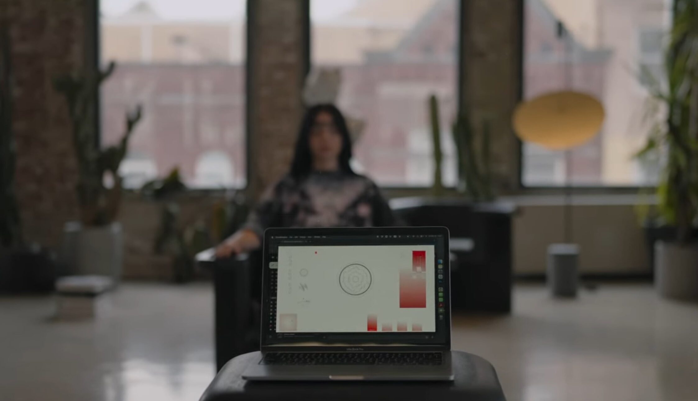 Wide shot of Shae with the EEG in the foreground.