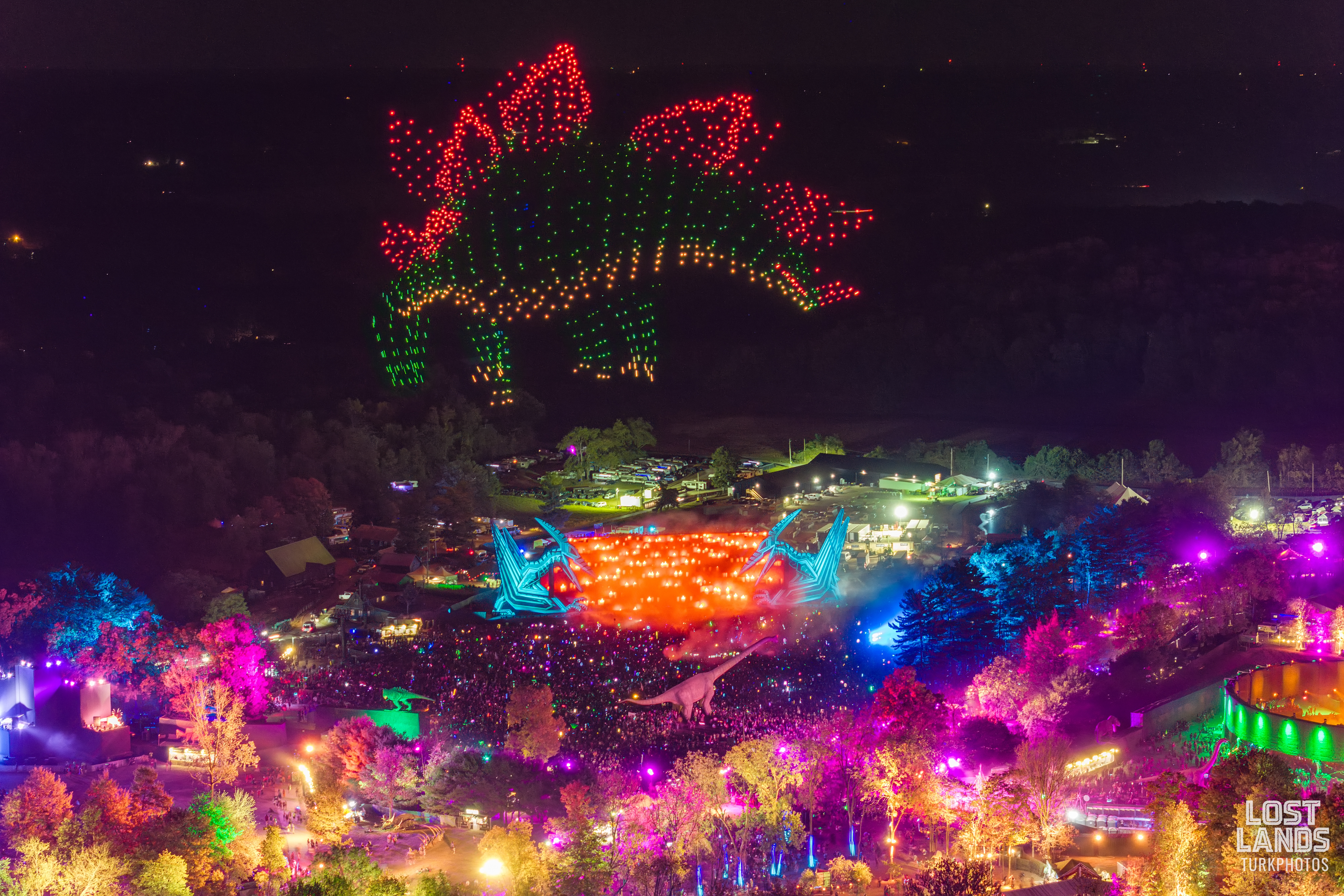 Overhead shot of Lost Lands illuminated at night with a drone show.