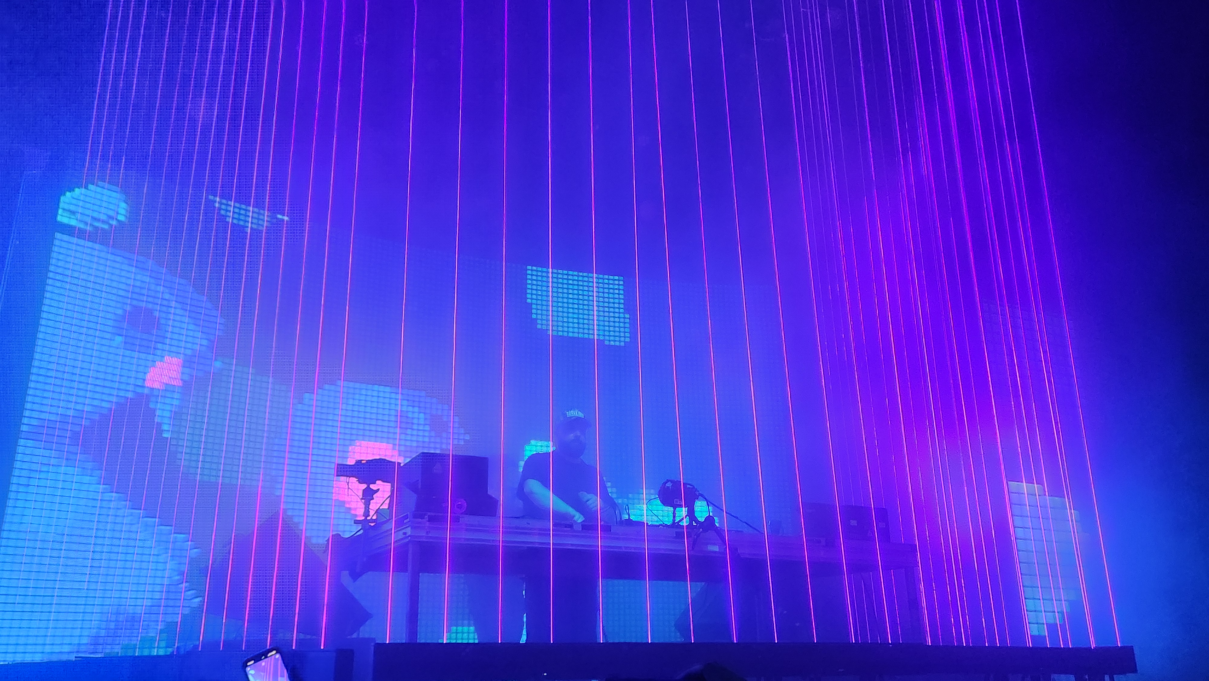 Pink Lasers surround Heyz in a Laser Cage